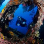 A scuba diver explores the USAT Liberty Wreck in Tulamben, Bali