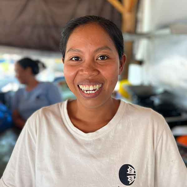 Kadek Anis, kitchen staff member at Let's Dive Tulamben dive center in Bali.